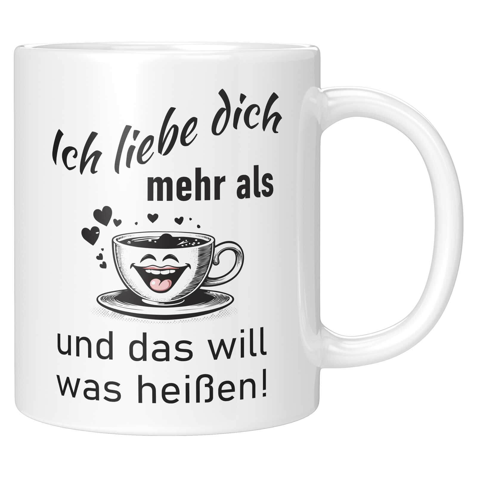 Weiße Tasse mit dem humorvollen Spruch „Ich liebe dich mehr als … und das will was heißen!“ und lachender Kaffeetasse mit Herzen.